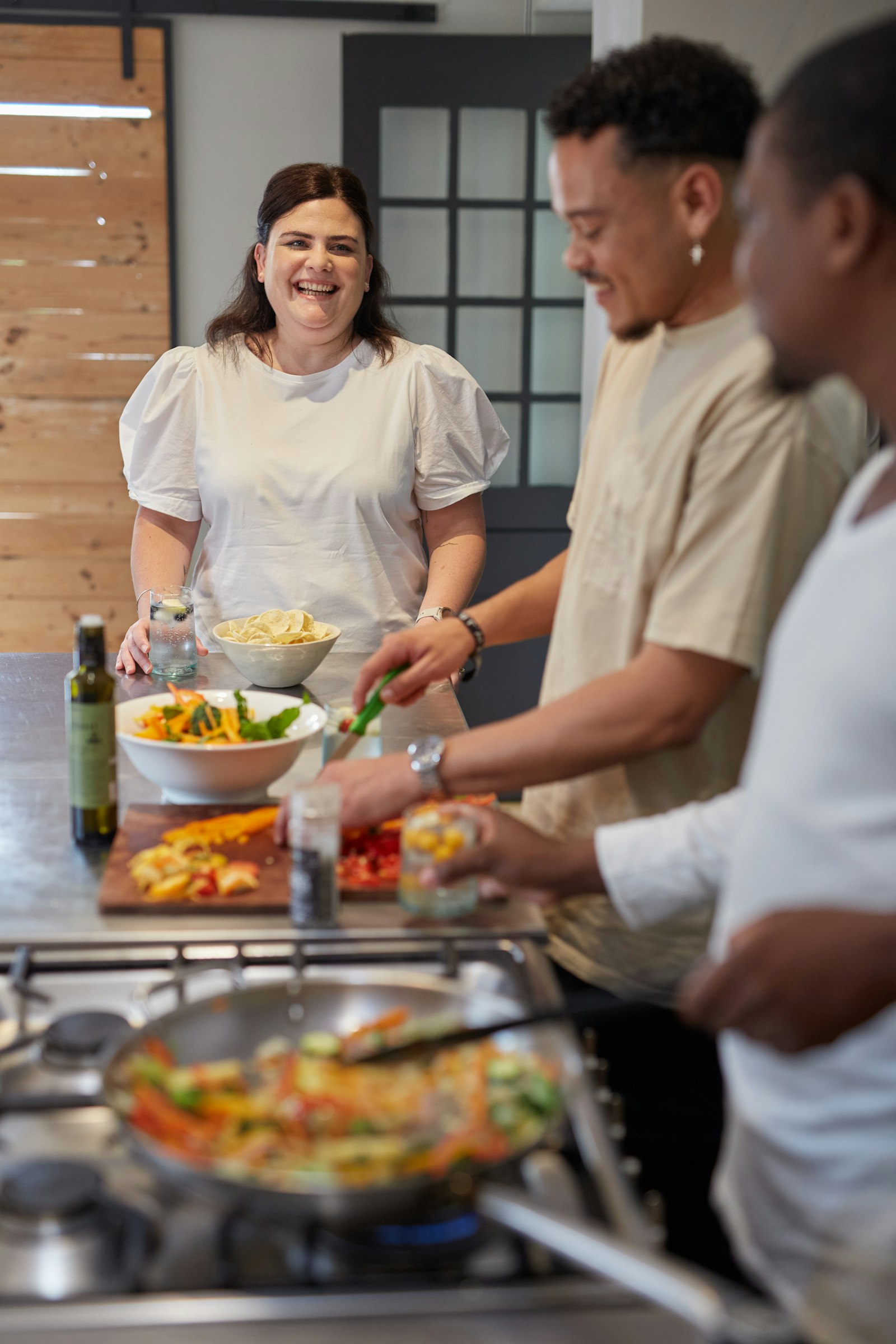 People preparing food together in a kitchen